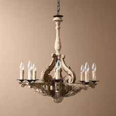 a chandelier with candles hanging from it's center and four lights on each side