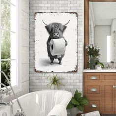 a bathroom with a cow holding a roll of toilet paper