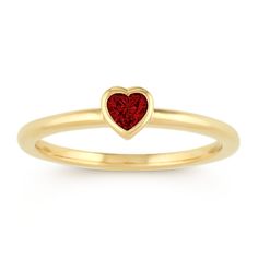 A single vibrant heart-shaped ruby  at approximately .18 carat total gem weight  is the focal point in this lovely stackable ring. Crafted of quality 14 karat yellow gold  the bezel-set design measures 4.8mm wide and is part of our Limited Collection. Yellow Gold Heart Cut Stackable Rings For Valentine's Day, Yellow Gold Stackable Heart Cut Rings For Valentine's Day, Red Heart Cut Birthstone Ring In 14k Gold, Red Heart Birthstone Ring In 14k Gold, 14k Gold Heart Cut Red Birthstone Ring, Red 14k Gold Heart Ring With Birthstone, Heart Cut Red Birthstone Ring In 14k Gold, Yellow Gold Stackable Rings For Valentine's Day, Valentine's Day Yellow Gold Birthstone Ring