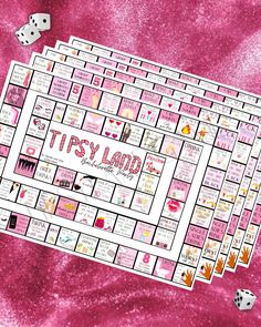 a pink board game with words and dices on it, surrounded by other games