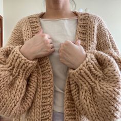 Super soft and comfortable to wear. Hand knit with pure wool 5WP, 1,200-1,300 grams Approx Size: Width 29-30"                         Length 21 " P.s. Model wearing cardigan is 5'3 / 104 lbs. Made to order takes 1-2 week to knit and shipping. I am happy to knit custom sweater if you would love to have other colors or design, just feel free to message me! Care: hand wash in cold water not over 30 degree, lay flat to dry. Cozy Merino Wool Sweater Coat For Cold Weather, Thick Wool Sweater With Long Sleeves, Chunky Knit Merino Wool Fall Outerwear, Chunky Knit Merino Wool Outerwear For Fall, Fall Merino Wool Chunky Knit Sweater Coat, Fall Merino Wool Sweater Coat In Chunky Knit, Oversized Knitted Beige Outerwear, Knitted Merino Wool Outerwear For Fall, Beige Merino Wool Sweater Coat For Winter