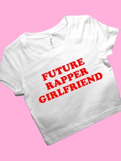 Future Rapper Girlfriend SNUG FIT Crop Top | Cute Crop Top | Graphic Top | Gift For Her | Y2K Baby Tee | Y2K crop top | Gift for friend Comfy Top to Lounge in! Actual item may be lighter/darker than pictured. M A T E R I A L S - SNUG FIT - 100% RING SPUN COTTON - Shoulder Taping S I Z I N G - Size chart is available on our listing photos. S H I P P I N G  &  P R O D U C T I O N  T I M E - Production Time is 2-3 Business Days. (May be delayed during the Holiday Season) - Shipping Time is 2-5 Busi Future Rapper, Y2k Crop Top, Cute Crop Top, Baby Tees Y2k, Y2k Baby Tee, Y2k Clothing, Workout Crop Top, Graphic Top, Cute Crop Tops