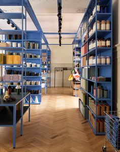 a room with blue shelves filled with lots of items