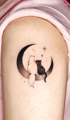 a cat is sitting on the moon with stars in its paws tattoo design for women