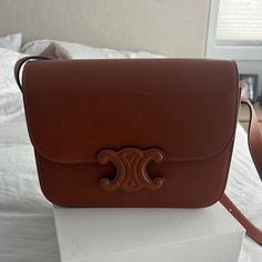 Brand New And Never Worn Authentic Celine Natural Calfskin Medium Triomphe In Tan. Features And Adjustable Strap Comes With Box And Dust Bag. Absolutely Stunning! No Longer Sell This With The Tan Closure Retails $4300 Luxury Tan Flap Shoulder Bag, Luxury Tan Crossbody Flap Bag, Luxury Tan Bag With Leather Lining, Tan Luxury Flap Bag, Designer Tan Flap Bag For Evening, Classic Tan Bags For Everyday Luxury, Designer Tan Bag With Leather Lining, Luxury Brown Calf Leather Flap Bag, Designer Calf Leather Flap Bag