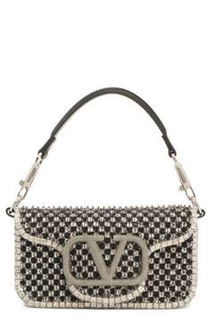 Starkly contrasting crystals and beads bring glam appeal to this leather shoulder bag that showcases a '90s-inspired silhouette and iconic VLOGO hardware. 6"W x 4"H x 2"D(interior capacity extra-small.) 5"strap drop; 23"crossbody strap drop 1.48lb Magnetic-snap flap closure Removable top carry handle; removable pull-through chain strap Interior wall pocket Structured silhouette with level base for stability Suede lining Leather Made in Italy Designer Handbags Designer Embellished Top Handle Shoulder Bag, Designer Embellished Rectangular Shoulder Bag, Luxury Beaded Shoulder Bag, Luxury Leather Embellished Shoulder Bag, Luxury Embellished Leather Shoulder Bag, Luxury Embellished Top Handle Shoulder Bag, Luxury Beaded Shoulder Bag For Fashion, Designer Leather Shoulder Bag With Rhinestones, Luxury Embellished Shoulder Bag