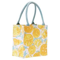 a yellow and blue shopping bag with lemons on the front, sitting against a white background