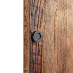 a wooden door with a black knob on it