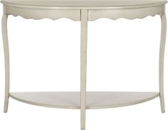 an oval white table with scalloped edges and a shelf on the bottom,