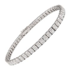 Stunning modern straight radiant cut diamond tennis bracelet. High jewelry by Alexander Beverly Hills. 54 radiant cut diamonds, 9.54 carats. Approximately G/H color and VS2/SI1 clarity. 18k white gold, 10.53 grams. Accommodated with an up to date appraisal by a GIA G.G., please contact us with any questions. Thank you. Item Number BS1389 10 Carat Tennis Bracelet, Bracelet Tennis, American Modern, Diamond Tennis Bracelet, Radiant Cut Diamond, Radiant Diamond, Tennis Bracelet Diamond, Radiant Cut, High Jewelry