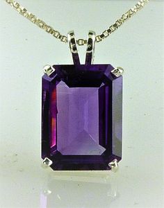 All our jewelry is handcrafted in the USA What a gorgeous Amethyst pendant this is! With rich purple color. This beautiful stone is an Emerald cut Amethyst, not too large and not too small 9.24 carats that is sure to turn heads. Set in a simple classic setting of solid .925 sterling silver. What February baby do you know that needs one of these? She'll be so impressed... Amethyst is the birthstone for February. Amethyst, (1) Emerald Cut 16x12 mm, 9.24 carats. If you need this item for a special February Baby, Rich Purple, Pink Amethyst, Amethyst Necklace, Amethyst Pendant, Crystal Necklace Pendant, Quartz Ring, February Birth Stone, Crystal Rings