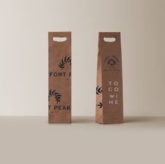 two brown paper bags with the words fort to go wild one printed on each bag