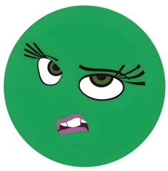 a green frisbee with an angry face drawn on it