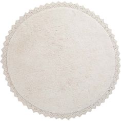 a round white rug with scalloped edges