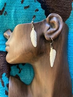 These earrings are one of a kind. They are hand carved out of cow bone. Each one is carved separately and by hand so there will always be an unique difference between them. Bohemian Bone-colored Nickel-free Earrings, Bohemian Bone-colored Earrings, Bohemian Bone-colored Pierced Earrings, Bone Earrings, Cow Bones, Carved Bone, Bone Carving, Feather Earrings, Earrings Dangle