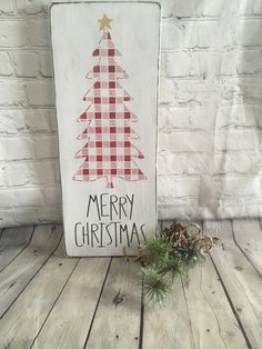 a wooden sign with a christmas tree on it