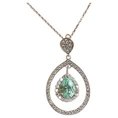 Specifications: Metal: 18K white gold (Au 70-75%) Weight: 4.8 Gr Main Stone: 1.62 ct Pear Shaped Paraiba (Tourmaline) Side stones: 71 ps Diamonds approximately 0.75ctw Length: 18 inch Pendant measurements: 1.25 inch x 0.75 inch Hallmark: '750' Paraiba Tourmaline, Halo Pendant, Modern Necklaces, Drop Necklace, Modern Jewelry, Halo Diamond, Diamond Pendant, Pear Shaped, Diamond White