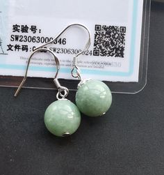 "Round ball 10mm natural green jadeite jade stone earring 925 silver hook,Grade A,amulet,protector,good mood,good lucky gift,earring dangle material:natural jadeite jade,rope  Size:  10mm Color:  green as photo,This earring comes with a Chinese jewelry Certified, \"rich and honored,Bless and protect,you all peace and prosperity, a happy life and a successful career\"  Price:  one pair.   100% as photo,  This is the best gift for yourself or friends, family, ❤ If you want other length Bracelet, Please connect me free. ❤Please read the store policy before purchase. ❤ Thank you for visiting my shop!" Hypoallergenic Round Jade Earrings, Lucky Gifts, Chinese Jewelry, Earring Dangle, Successful Career, Jade Stone, Stone Earrings, Good Mood, Earring Gifts