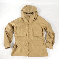 "Vintage Hunting Parka Two-way zipper with storm flap closure, 4 flap pockets, 2 elastic shotgun shells holders, velcro-adjustable cuffs, hood Mens label: L (FITS MEN'S L TO XL) Please check the measurements Measurements approx.: pit to pit across front 26\", length from collar seam to the end of sleeve 33\", jackets length approx 32\" Condition: great condition Mfg.: Gamehide C 1970's-80's" Tactical Windbreaker For Fall Hiking, Tactical Khaki Windbreaker With Pockets, Military Style Windproof Outerwear For Outdoor, Combat Style Khaki Outerwear For Outdoor Activities, Khaki Combat Outerwear For Outdoor Activities, Functional Waterproof Windbreaker For Hunting, Khaki Windproof Hunting Outerwear, Functional Fall Hunting Windbreaker, Tactical Khaki Outdoor Outerwear