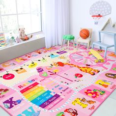 a child's play room with pink rugs and colorful toys on the floor