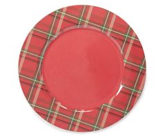 a red plate with a green plaid pattern on the rim is shown in front of a white background