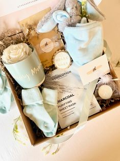 a box filled with baby items on top of a table