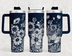 three travel mugs with floral designs on them