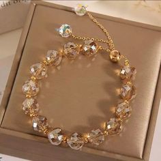 Gold Tone Metal. Adjustable Pull Chain. Champagne Beads, High Shine. Total Length Of Bracelet Is 11 Inches. Knit Bracelet, Swarovski Beads, Beaded Rope, Personalized Bracelets, Strand Bracelet, Dress Jewelry, Crystal Bracelet, Braided Bracelets, Adjustable Bracelet