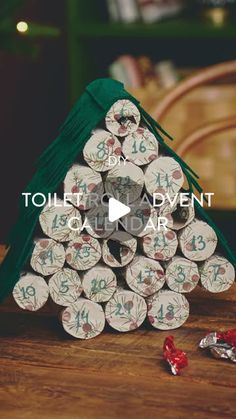 a small christmas tree made out of toilet paper with the words toilet roll and event written on it