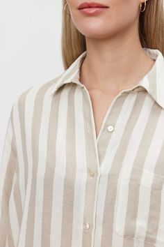 This button-up features timeless stripes, a single chest patch pocket, and a relaxed fit with a scooped hemline for versatile, laid-back style. Classic Striped Linen Tops, Striped Linen Top With Button Closure, Striped Shirt With Relaxed Fit And Spread Collar, Striped Linen Tops For Work, Casual Shirt With Vertical Stripes And Shirttail Hem, Everyday Striped Collared Shirt, Striped Tops With Pockets For Daywear, Striped Everyday Summer Shirt, Blouse Size Chart