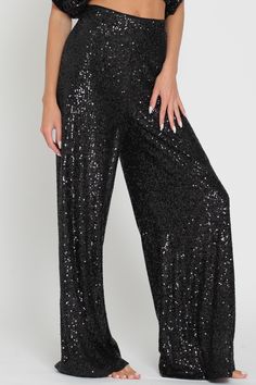 Slip into something sparkly! Our high waisted sequin pants are the perfect party pieces for those looking to glam up their night out - they'll hug your curves and show off your booty! With an elastic back waist, polyester lining, and shimmering sequins, these sleek pants are sure to turn heads. Shine on! Chic Sparkling Bottoms For Party, Shimmer Bottoms For Party And Holiday Season, Glamorous Long Pants For Party, Glamorous Sparkling Bottoms For Night Out, Disco Party Bottoms With Glitter, Chic Sparkling Party Bottoms, Black Glitter Party Bottoms, Party Glitter Bottoms For Party Season, Holiday Party Shimmer Bottoms