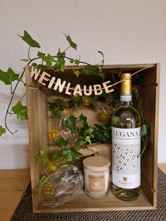 a bottle of wine sitting in a wooden box