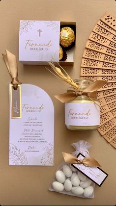 a table topped with lots of chocolates next to a card and some paper tags