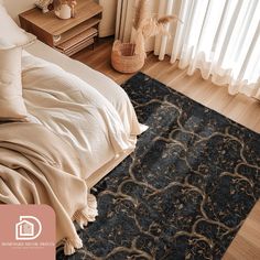 a bed sitting next to a window in a bedroom on top of a wooden floor