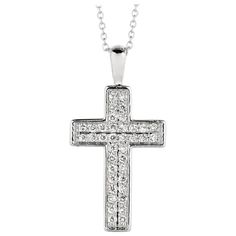 0.35 Carat Natural Diamond Cross Necklace 14K White Gold G SI 18 inches chain 100% Natural Diamonds, Not Enhanced in any way Round Cut Diamond Necklace 0.35CT G-H SI 14K White Gold Pave style 3.00 gram 1 inch in height, 1/2 inch in width 38 stones N5393WD ALL OUR ITEMS ARE AVAILABLE TO BE ORDERED IN 14K WHITE, ROSE OR YELLOW GOLD UPON REQUEST. All Chains of Pendants and Necklaces Can be Requested in 16'' or 18'' Length. . This item is proudly handcrafted in the USA. Perfect gift on any occasion. This Item has passed highest quality inspections. We want you to Wear it, Enjoy it, and Show it off! In case you are not 100% satisfied with this exquisite, elegant and lovely item we have a no hassle 30 day money back return policy. Please message our support team for any questions. Anniversary Cross Necklace With Pave Setting, Anniversary Necklace With Polished Cross Pendant, Anniversary Necklace With Pave Setting Cross Pendant, Anniversary Cross Pendant Necklace With Pave Setting, Classic Brilliant Cut Cross Pendant Necklace, Classic Cross Pendant Necklace With Brilliant Cut, White Gold Cross Pendant Necklace With Pave Setting, Diamond White Cross Pendant Necklace For Formal Events, Classic Cross Pendant Necklace With Pave Setting