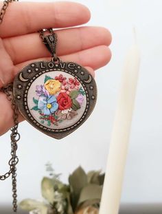 Rainbow necklace with floral embroidered heart design pendant -  long chain necklace - vintagestyle - love lettering necklace The embroidered part of the pendant measures  diameter 3.5 cm. The chain is about 62 cm. I use fine ribbon and dmc threads. Valentine's Day Gift Long Necklace, Vintage Personalized Jewelry As Gift For Her, Personalized Vintage Jewelry As Gift For Her, Bohemian Flower Pendant Necklace As Gift, Bohemian Necklace With Flower Pendant As Gift, Bohemian Wedding Necklaces With Flower Charm, Bohemian Heart Pendant Jewelry For Gifts, Bohemian Heart Pendant Jewelry Gift, Vintage Handmade Flower Jewelry