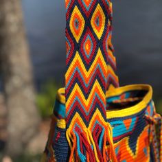 Crochet bag, authentic Wayuú Mochila Bag , Hand-made Wayuu Bag,Premium quality, bucket bag, drawstring bag, Large Size. -Original handmade Wayuu mochila bag that will go with any outfit. -The stunning, one-of-a-kind, 100% handmade crossbody has been carefully crocheted. This is an unique high-quality crochet bag which contain a beautiful color combination and tribal patterns -This beautiful Wayuu bag that was carefully crafted using a single thread technique, which is the most traditional croche Artisan Woven Bucket Bag, Artisan Multicolor Bucket Bag For Daily Use, Artisan Multicolor Bucket Bag With Adjustable Strap, Multicolor Handwoven Bucket Bag As A Gift, Multicolor Bucket Bag With Braided Handles, Artisan Style Bucket Bag For Festivals, Artisan Bucket Bag For Festival, Traditional Multicolor Bucket Bag With Adjustable Strap, Artisan Festival Bucket Bag