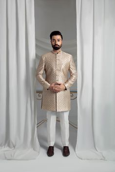 Elevate your formal attire with our Beige Prince Coat. Made from pure atlas material, this coat boasts a luxurious pure silk lining, perfect for any special occasion. The included raw silk kurta pajama and shawl, featuring embroidered borders, complete the elegant look. 4-Piece Suit Elegant Semi-formal Sets For Eid, Elegant Silk Sherwani With Resham Embroidery, Elegant Raw Silk Sherwani Straight Kurta, Elegant Unstitched Suit With Naqshi Straight Kurta, Elegant Sherwani In Raw Silk With Straight Kurta, Silk Kurta With Naqshi For Wedding, Elegant Raw Silk Sherwani With Intricate Embroidery, Silk Naqshi Kurta For Wedding, Elegant Embroidered Silk Sherwani