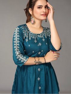 HAND CRAFTED TUNIC DESCRIPTION * Teal regular cinched waist top * Flora Embroidered * Round neck, three-quarter, regular sleeves * Embroidered detail * Woven *Fabric:- Rayon *Package Contains:- Only one kurti *Wash Care:- Hand Wash AVAILABLE IN 7 SIZES THEY ARE IN FOLLOWING MEASUREMENTS IN INCHES:- XXS:- Bust-32/Waist-24/Length-30 XS:- Bust-34/Waist-26/Length-30 S:- Bust-36/Waist-28/Length-30 M:- Bust-38/Waist-30/Length-30 L:- Bust-40/Waist-32/Length-30 XL:- Bust-42/Waist-34/Length-30 XXL:- Bust Indowestern Kurti, Western Kurtis, Kurti Top, Indian Tops, A Line Kurti, Kurtis For Women, Indian Tunic, Short Kurta, Fashion Tops Blouse