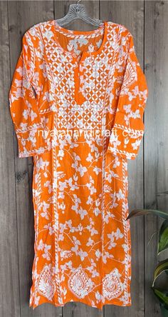 Spring Floral !! Soft and beautiful Chikankari kurta with a floral print. Length-45 inches Spring Orange Straight Kurta, Summer Orange Kurta With Printed Motifs, Orange Kurta With Printed Motifs For Diwali, Traditional Orange Floral Print Kurta, Diwali Orange Kurta With Printed Motifs, Orange Printed Motifs Kurta For Navratri, Orange Printed Kurta For Navratri, Orange Kurta With Printed Motifs For Navratri, White Traditional Wear With Printed Motifs For Spring