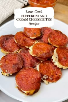 mini pepperoni and cream cheese bites on a white plate with the words low carb