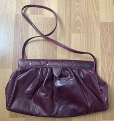 "Vintage Susan Gail  Medium Brown Suede Leather Crossbody Bag Clutch Purse  Gold Tone Trim, One Interior pockets, Snap Closure  Made in Spain  Condition is Used The interior and exterior are in very good condition.  Length 15\" x Width 3\" x Height 9\" Strap drop 17\" This was a rare find, especially in this condition." Vintage Burgundy Shoulder Bag With Adjustable Strap, Burgundy Soft Leather Evening Shoulder Bag, Evening Burgundy Soft Leather Shoulder Bag, Vintage Burgundy Bag With Adjustable Strap, Vintage Evening Bags With Adjustable Strap, Formal Pouch Bag With Snap Closure, Vintage Evening Shoulder Bag In Soft Leather, Vintage Soft Leather Evening Shoulder Bag, Vintage Formal Shoulder Bag With Mobile Phone Bag