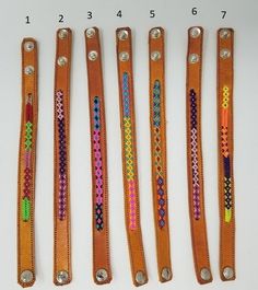 four different types of belts with beading on each one side and the other half