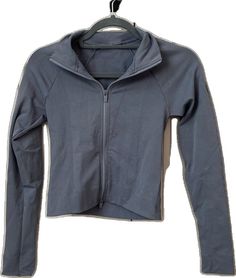 Fitted Fall Activewear For Sports, Fall Sports Fitted Activewear, High Stretch Casual Outerwear For Training, Sporty Stretch Outerwear With Thumbholes, Fitted Sporty Track Jacket For Fall, Winter Athleisure Fitted Track Jacket, Casual Fitted Track Jacket For Gym, Fitted Winter Athleisure Track Jacket, Fitted Track Jacket For Fall Sports