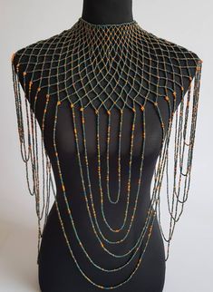 "This shoulder necklace is 100% handmade. Perfect for weddings , African themed events, cultural events or any other event. The list is endless.... Size; 22\" long for the longest strand. 16\" around the neck. **Buy multiple items and pay shipping for 1 item only.The rest ships free. More neckleces here; https://www.etsy.com/shop/TribalTess?ref=seller-platform-mcnav&section_id=21306083 Back to my shop; https://www.etsy.com/shop/TribalTess?ref=seller-platform-mcnav" Handmade Bohemian Bridal Necklace For Party, Bohemian Beaded Necklaces With Dangling Beads For Weddings, Bohemian Beaded Necklaces With Large Beads For Weddings, Bohemian Beaded Necklace With Dangling Beads For Wedding, Beaded Long Bridal Necklace For Party, Beaded Long Bridal Necklace, Bohemian Wedding Beaded Necklaces With Large Beads, Bohemian Tiny Beads For Wedding, Elegant Handmade Body Jewelry For Festival