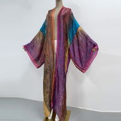 One Size fits S-3X/4X Kimono length: 58inch Material: Poly Silk (a lightweight, smooth, and shiny fabric that drapes and flows very well. An affordable alternative to silk) One Size Fits Most Size Chart Elegant Flowy Multicolor Kimono, Elegant Multicolor Flowy Kimono, Long Multicolor Party Kimono, Elegant Multicolor Kimono For Beach, Elegant Multicolor Beach Kimono, Long Silk Flowy Kimono, Elegant Long Multicolor Kimono, Unique Kimono, Mandala Floral