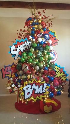 a christmas tree decorated with comic ornaments and baubles is displayed in a room