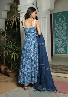 Farah smoked printed blue anarkali suit with pant and dupatta set is perfect for a festive season . Cotton cambric fabric makes it perfect for summer weather. Mirror work shell strap with gota detailing on the dupatta give the set a classic look. Product has lining. Pant has two side pockets, back elasted waistband. Cold wash and Dry clean only.Type of Work: Hand Block/ Solid Fit: Fitted at bust Model Height: 5'4 Measurements: Kurta- 52.25" Pants- 36.25" Dupatta- 95.75" SKU#: 11703066BL Disclaim Kurti Designs With Shells, Kurta For Navratri Women, Strap Suit Design Indian, Blue Kurti Design, Blue Kurta Set For Women, Strap Kurti, Bridal Suits Punjabi, Sleeveless Kurti, Indian Dress Up