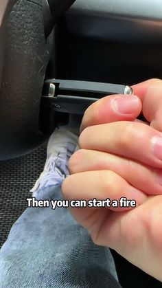 someone is holding their hand on the steering wheel of a car and it says, then you can start a fire