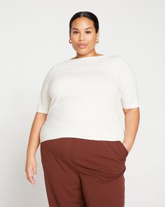 The Bella Boatneck Tee is the effortless and covetable top ready to be styled in every way. Made from super soft Peruvian cotton that feels so good, you'll never want to take it off. Designed with an elegant, wide boatneck (that still covers your bra straps) and a longer hem that you can scrunch up or tuck into your favorite bottoms. It's all in the little details. Fit: Fitted, view the product size guide Fabric: 93% Pima Cotton, 7% Elastane Care: Turn inside out, machine wash cold, lay flat to Effortless Relaxed Fit Top With Shirttail Hem, Versatile Relaxed Fit Knit Top For Loungewear, Relaxed Fit Tops For Layering, Effortless Stretch Tops For Everyday, Effortless Crew Neck Stretch Tops, Oversized Versatile Top, Effortless Stretch Crew Neck Top, Effortless Top With Shirttail Hem, Effortless Tops With Shirttail Hem